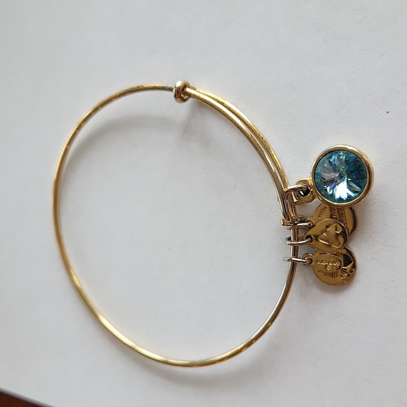 Alex and Ani Jewelry - Set of 3 Alex and Ani gold tone bracelets.